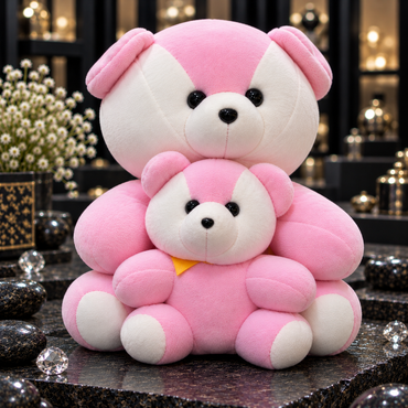 Large and small pink teddy bears with white face panels, white muzzles and foot pads, black eyes and noses, and a yellow neck accent on the smaller bear.