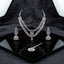 Silver-Tone Blush Pink Pear CZ & White CZ Pavé Lotus Petal V-Necklace Jhumka Earrings & Maang Tikka 3-Piece Bridal Set on black mirror geometric tray with dark grey silk drape backdrop
