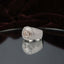 Silver Champagne CZ Solitaire Baguette Sunburst Halo Iced Pavé Signet Ring luxury flat-lay on mirror glass surface with deep burgundy velvet backdrop
