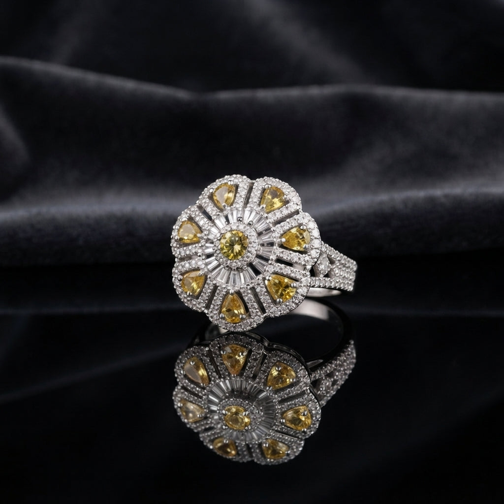 Silver CZ Art Deco Sunburst Flower Pear Petal Pavé Cocktail Ring in Yellow Citrine — yellow citrine CZ pear petals and round center on wide white pavé split shank, luxury product shot on black mirror surface with dark charcoal silk backdrop