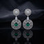 Silver CZ Concentric Orbit Double Disc and Pear Connector Drop Earrings in Smoke Grey on dark mirror surface with charcoal satin backdrop showing rhodium silver pair with concentric cushion orbit stud white pear connector and large orbit disc pendant with round cushion smoky grey CZ centre solitaire