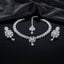 Silver CZ Diamond-Illusion Bridal 3-Piece Jewelry Set on black mirror surface with dark grey silk backdrop showing V-shape CZ leaf chain necklace with large emerald-cut centre halo pendant and teardrop drop flanked by matching drop earrings with emerald-cut CZ halo top and teardrop drop and small maang tikka with CZ halo and teardrop drop with mirror reflection below