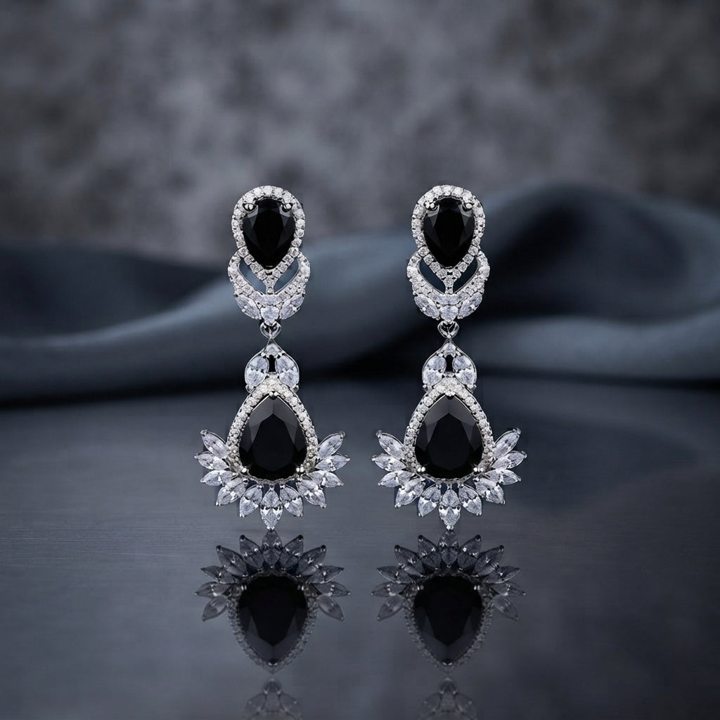 Silver CZ Double Teardrop Cabochon Lotus Fan Chandelier Earrings in Turquoise pair on dark mirror surface showing rhodium-plated small turquoise pear cabochon stud with white CZ pave halo infinity connector and large turquoise pear cabochon drop with white CZ pave halo and marquise CZ lotus fan crown with mirror reflection below