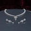 Silver CZ Floral Lattice Choker Necklace and Marquise Teardrop Earrings Bridal Set — rhodium silver-tone 2-piece bridal set with full-coverage continuous CZ micro-pavé floral lattice choker with Gothic arch fleur-de-lis center V-drop and hanging teardrop CZ pendant and matching elongated marquise CZ frame drop earrings displayed on dark mirror round tray with burgundy velvet backdrop