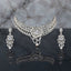 Silver CZ Grand Collar Bridal Necklace and Earrings Set in Blush Pink worn by South Asian model in mint blue embroidered kurta with marble backdrop showing wide crescent collar choker with blush pink oval CZ stones and grand floral bouquet pendant with matching drop earrings