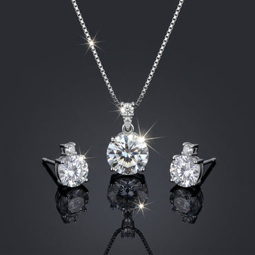 Silver-Tone Solitaire Round CZ Pendant Necklace and Earrings Set on dark background