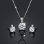 Silver-Tone Solitaire Round CZ Pendant Necklace and Earrings Set on dark background