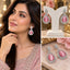 Silver AD Teardrop Halo Drop Earrings in Baby Pink shown on South Asian bridal model wearing blush pink embroidered outfit and on white display stand with marquise AD leaf cluster stud top and large open pear teardrop frame with baguette and round AD halo border and baby pink faceted pear AD centre stone