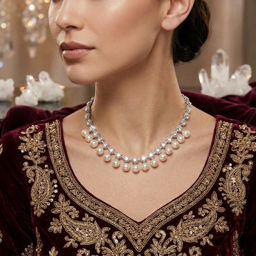 Silver-Tone CZ Tennis & Pearl Drop Fringe Choker Necklace worn on South Asian female model in deep burgundy velvet embroidered dress with crystal chandelier and quartz backdrop