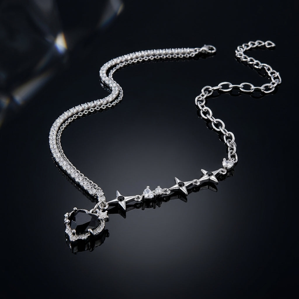 Silver-Tone CZ Tennis Star Heart Asymmetric Layered Necklace with dual chain and open heart pendant on dark surface