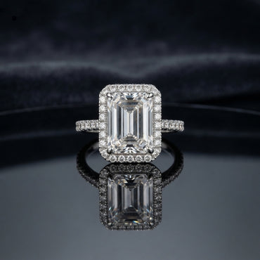 Silver Emerald Cut CZ Rectangular Halo Pave Band Solitaire Ring additional product image on dark mirror surface showing emerald-cut CZ solitaire with full rectangular white CZ halo and continuous micro-pave band in rhodium silver with mirror reflection