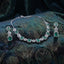 Silver Emerald Green CZ Cushion Halo Necklace and Linear Drop Earrings Bridal Set — rhodium silver-tone 2-piece bridal set with graduating cushion emerald green CZ halo station necklace with 5-petal CZ flower connectors and matching 3-tier linear drop earrings with cushion emerald green CZ halo displayed on dark teal embroidered fabric surface with botanical embroidery backdrop