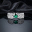 Silver Emerald Oval CZ Wide Leaf Openwork Pavé Band Cocktail Ring on dark grey mirror surface with dark grey satin drape backdrop