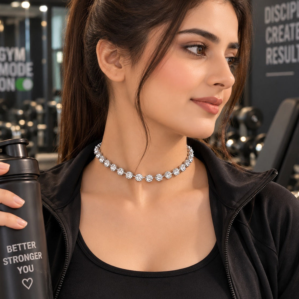 Silver-Tone Large Round Brilliant CZ 4-Prong Classic Tennis Choker Necklace worn on model at gym in black activewear with water bottle in hand