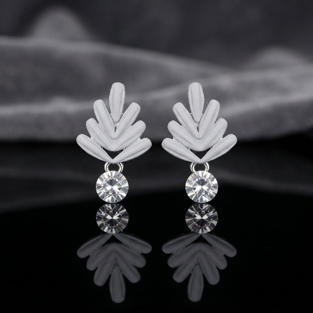 Silver Leaf Fan CZ Drop Stud Earrings pair on black mirror surface with dark grey silk fabric backdrop showing rhodium silver-tone matte wheat leaf fan stud top with 3 raised ribbed petal blades in V-chevron shape and single round brilliant bezel-set white CZ drop pendant below with mirror reflection