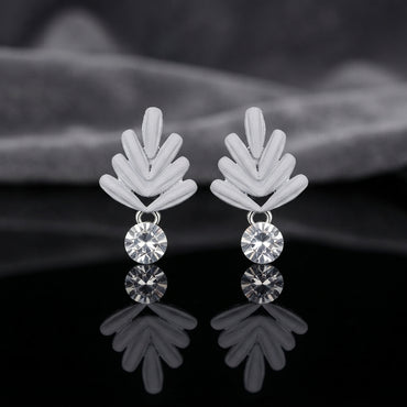 Silver Leaf Fan CZ Drop Stud Earrings pair on black mirror surface with dark grey silk fabric backdrop showing rhodium silver-tone matte wheat leaf fan stud top with 3 raised ribbed petal blades in V-chevron shape and single round brilliant bezel-set white CZ drop pendant below with mirror reflection