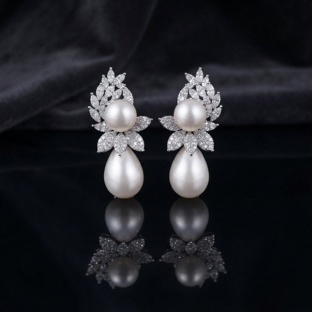 Silver-Tone Marquise CZ Wheat Leaf Cluster Double Pearl Drop Earrings on black mirror surface with dark grey silk fabric backdrop
