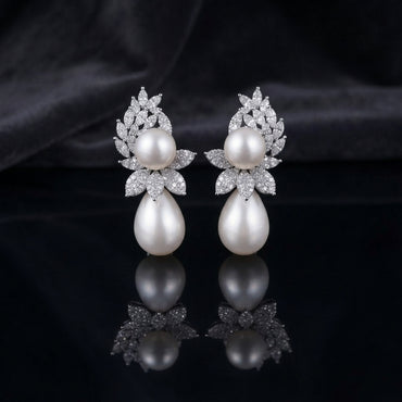 Silver-Tone Marquise CZ Wheat Leaf Cluster Double Pearl Drop Earrings on black mirror surface with dark grey silk fabric backdrop