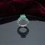 Silver CZ Statement Cocktail Ring in Paraiba Teal — very large round teal CZ center with marquise teal shoulder stones on full white CZ pavé dome band on burgundy velvet backdrop