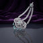 Silver Mint Green CZ Floral Filigree and Marquise Wheat Chain Grand Maang Tikka on dark mirror surface with purple velvet backdrop showing rhodium silver double-strand marquise white CZ wheat chain with 3-medallion open filigree flower pendant mint green CZ cabochon centres and 5 mint green pear drop fringe