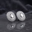 Gold-tone oval pavé stud earrings with smooth oval centers.