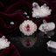Rose Gold-Tone Oval Ruby Pink CZ Scalloped Crown Round CZ Double Halo Cocktail Statement Ring on black mirror surface with white crystal quartz clusters, hematite beads and deep burgundy velvet backdrop