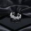 Silver Pear Rose-Cut CZ Eternity Wave Open Band Ring on black lacquer tray with dark grey satin drape backdrop