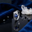Silver-Tone Pear Sapphire Blue CZ Marquise Flower Crown & Double Pavé Band Open Adjustable Bridal Ring on black mirror surface with white crystal quartz cluster, scattered black faceted beads and royal blue velvet backdrop