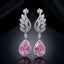 Silver-Tone Pink CZ Teardrop Halo Wheat Leaf Long Drop Earrings product shot on dark background