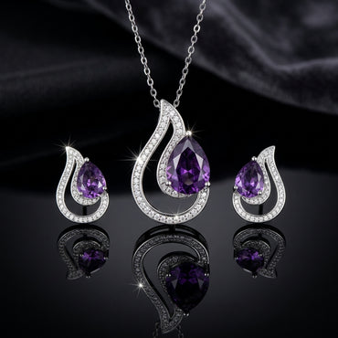 Silver-Tone Purple CZ Teardrop Swirl Pendant Necklace and Earrings Set on dark background