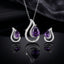Silver-Tone Purple CZ Teardrop Swirl Pendant Necklace and Earrings Set on dark background