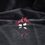 Silver CZ Statement Cocktail Ring in Ruby Red — large cushion-cut deep ruby red CZ center with graduated ruby red baguette step shoulders on dark marble backdrop