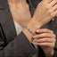 Silver-Tone Alternating CZ Pavé & Polished Heart Tennis Bracelet worn by model in grey blazer