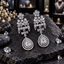 Pair of silver-tone chandelier earrings with clear floral clusters, horizontal accent rows, four-petal connectors and double-frame teardrop drops.