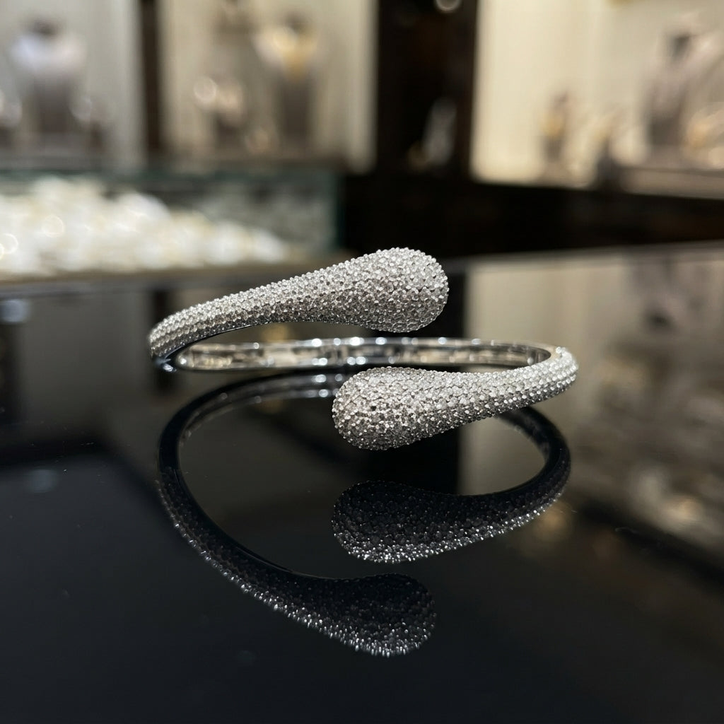 Gold-tone CZ pavé double teardrop bypass bangle with full micro-pavé CZ coverage