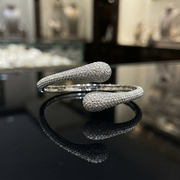 Gold-tone CZ pavé double teardrop bypass bangle with full micro-pavé CZ coverage