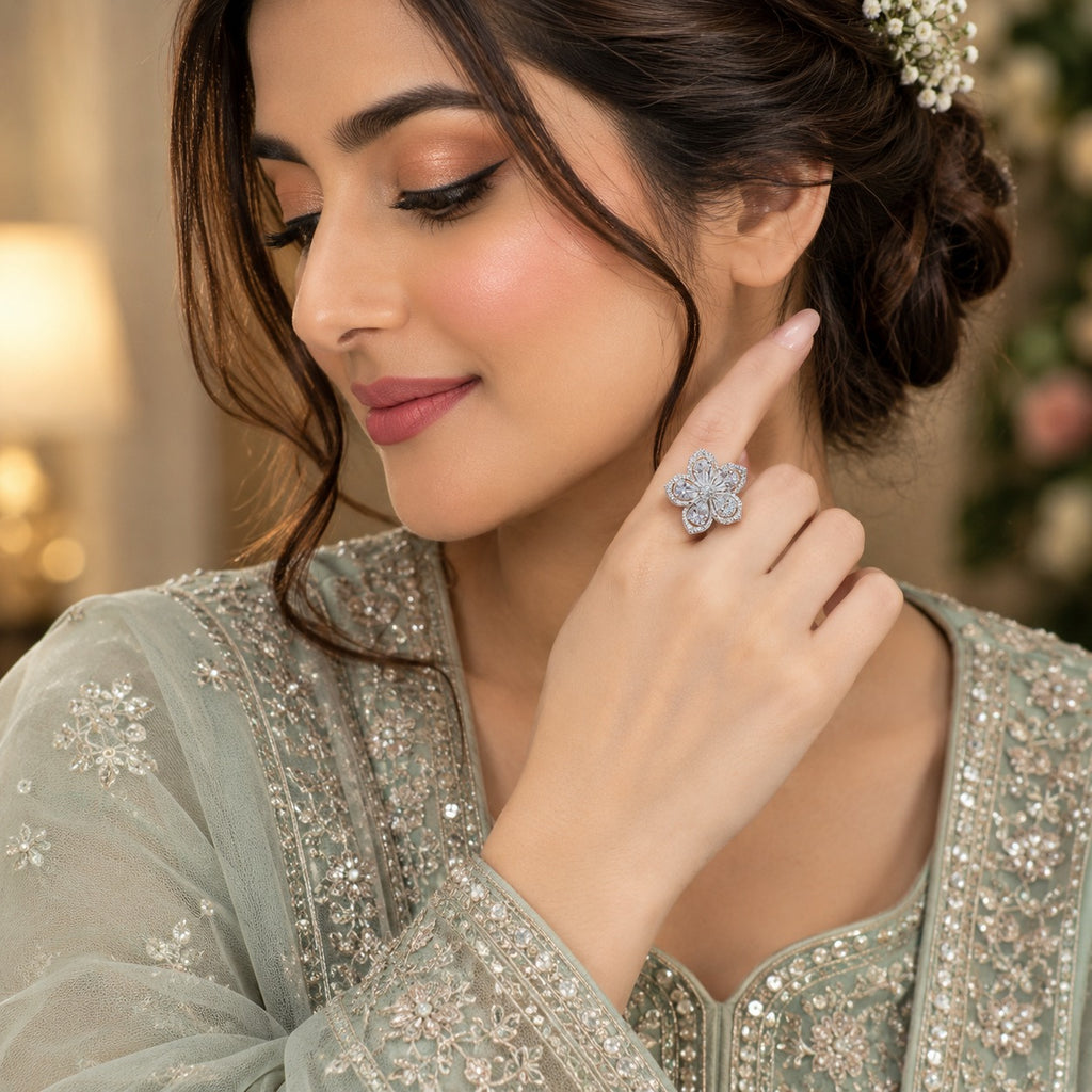 Silver-Tone CZ Pavé Four-Petal Flower Blossom Cocktail Statement Ring worn by model in Pakistani sage green bridal attire with floral hair accessory