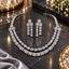 Silver-tone double-row necklace and matching drop earrings featuring clear oval accents, floral clusters, and two hanging earring sections.