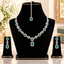 Silver-tone emerald green emerald-cut CZ halo rectangle link necklace earrings and maang tikka bridal set