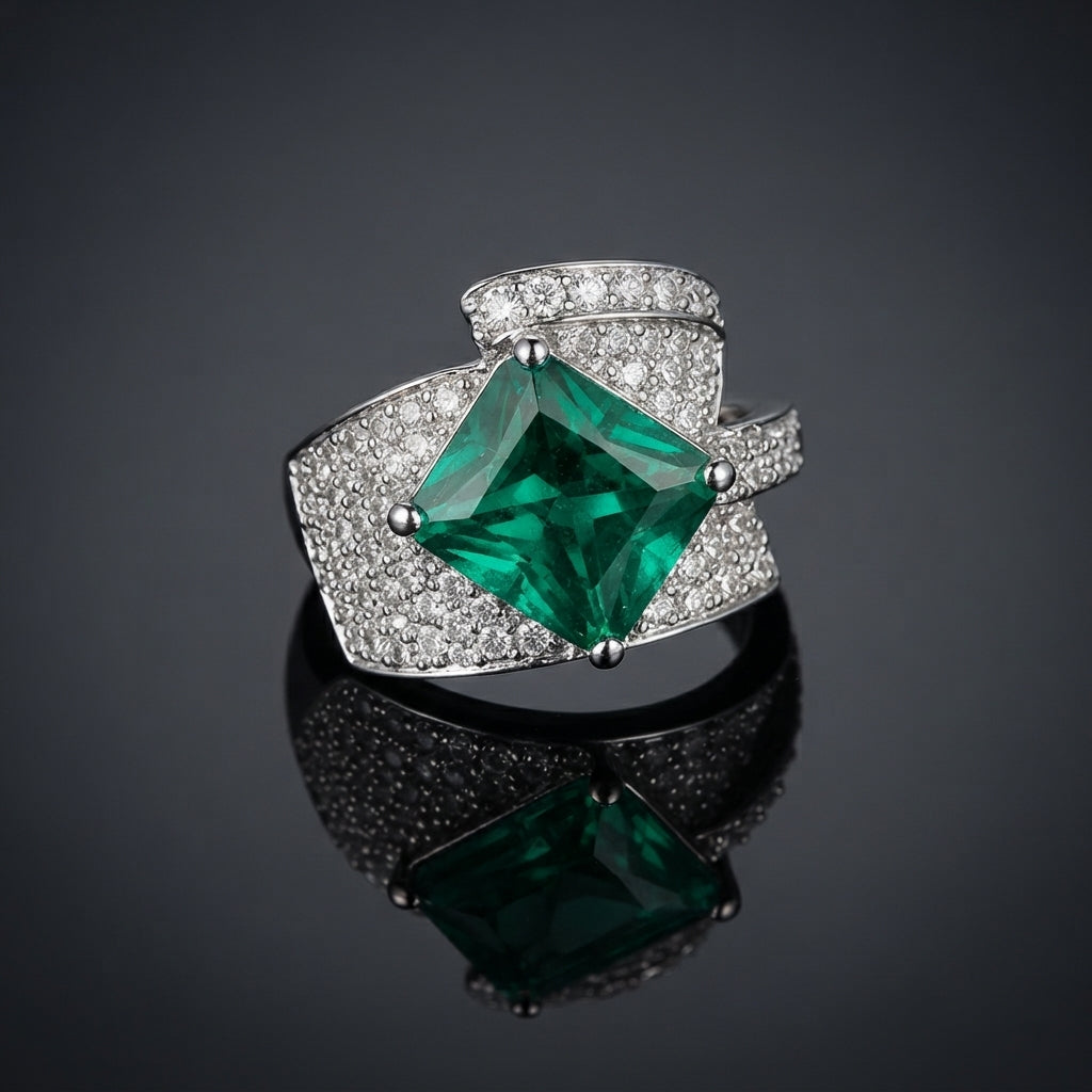 Silver-Tone Emerald Green Princess-Cut CZ Wide Pavé Band Cocktail Ring product shot on dark reflective surface