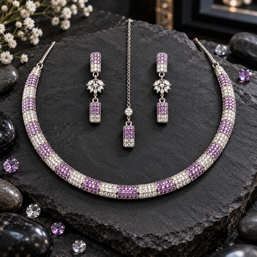 Silver-tone collar-style necklace with alternating lavender and clear-looking sections, matching tiered earrings and a rectangular-drop chain bindia.