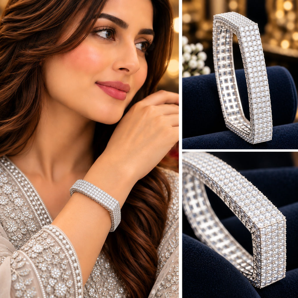 Silver-tone wide multi-row clear accent bangle shown on a model and in close-up views.