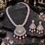 Silver-tone AD necklace and earrings set with pink oval accents, clear floral links, lattice fan panels and pink teardrop-shaped drops.