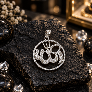 Silver-tone round Allah calligraphy locket with closely arranged clear accents on the lettering, an openwork centre, circular clear halo border and decorated top bail.