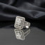 Silver White CZ Baguette Cluster Emerald-Cut Halo Split-Shank Pavé Cocktail Ring luxury flat-lay on mirror glass surface with charcoal silk backdrop