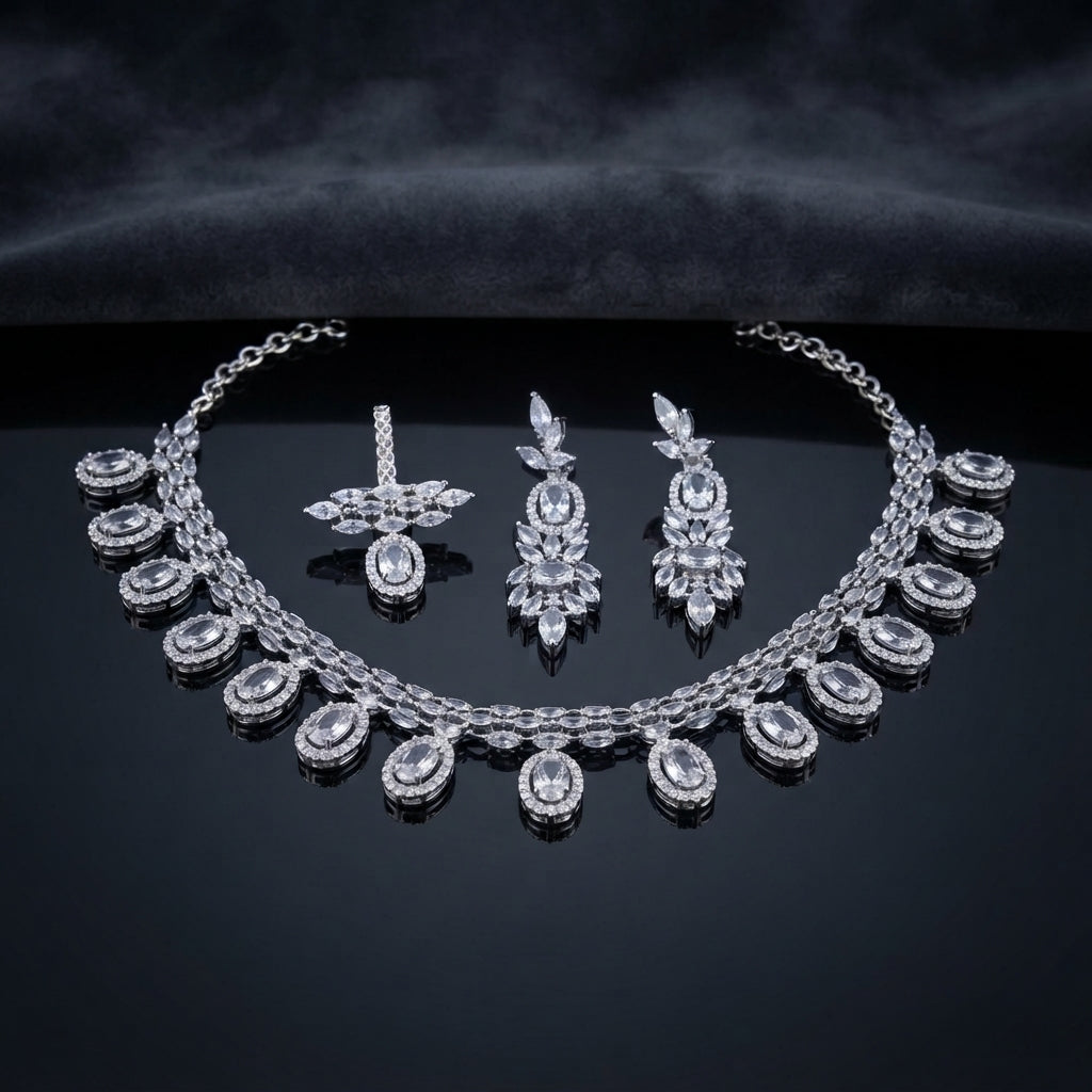 Silver White CZ Oval Halo Drop and Marquise Leaf Necklace and Earrings Bridal Set on dark mirror surface with charcoal satin backdrop showing rhodium silver double-strand marquise CZ tennis necklace with graduated oval white CZ halo drops and matching marquise leaf cluster stacked oval CZ drop earrings